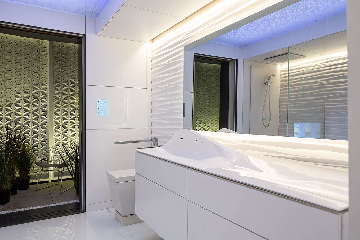 FutureHAUS bathroom with height-adjustable bathroom cabinet, sink and toilet.
